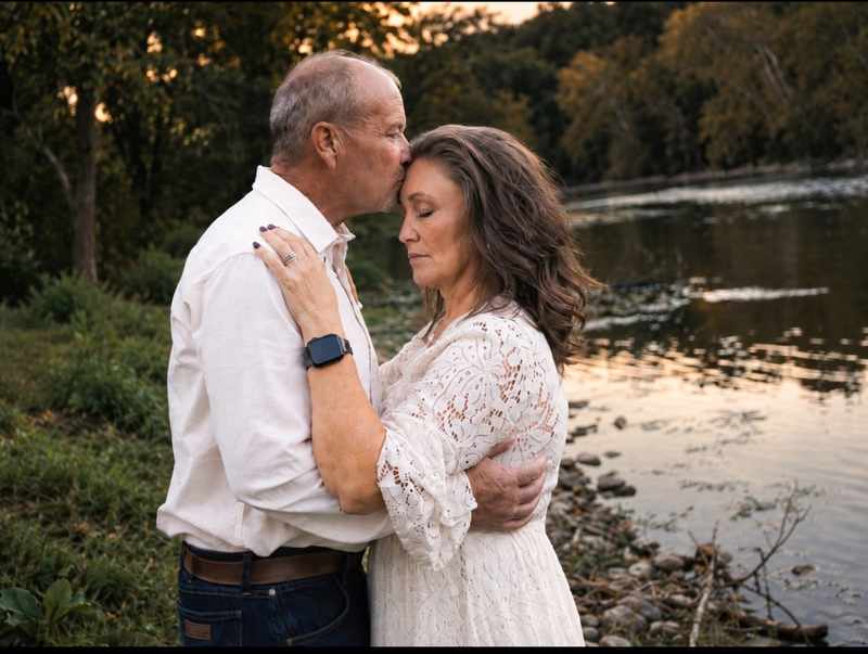 Tender forehead kiss beside the river