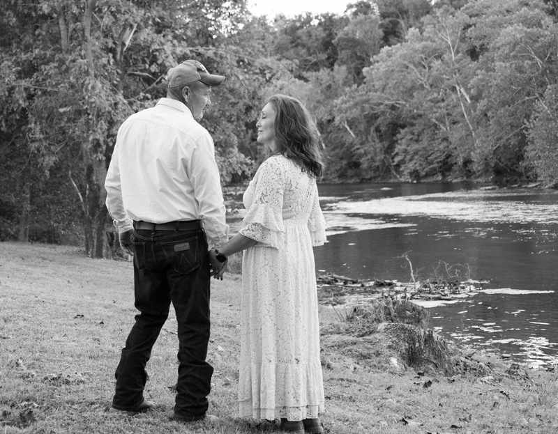 Black and white anniversary portrait by the river